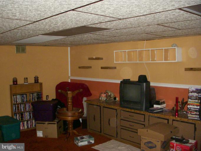 339 Sassafras Road Baltimore, MD 21221 - Photo 10 of 20 a view of a workspace with furniture