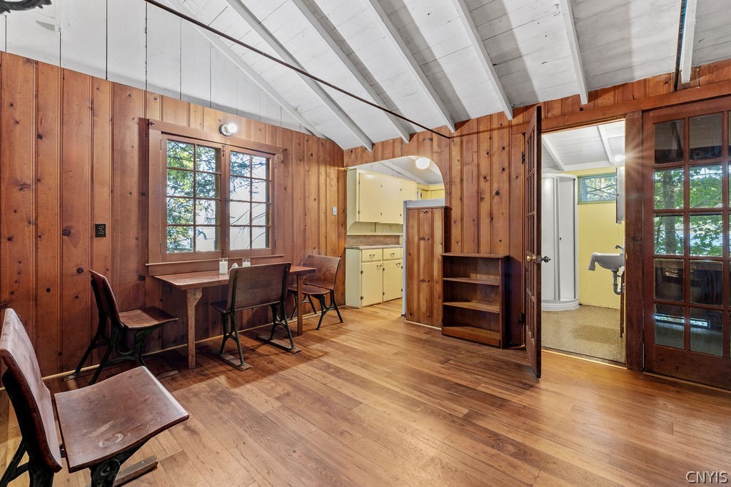 120 Ridings Drive Niles, NY 13077 - Photo 9 of 26 Living room with view to kitchen, bathroom and screened in porch