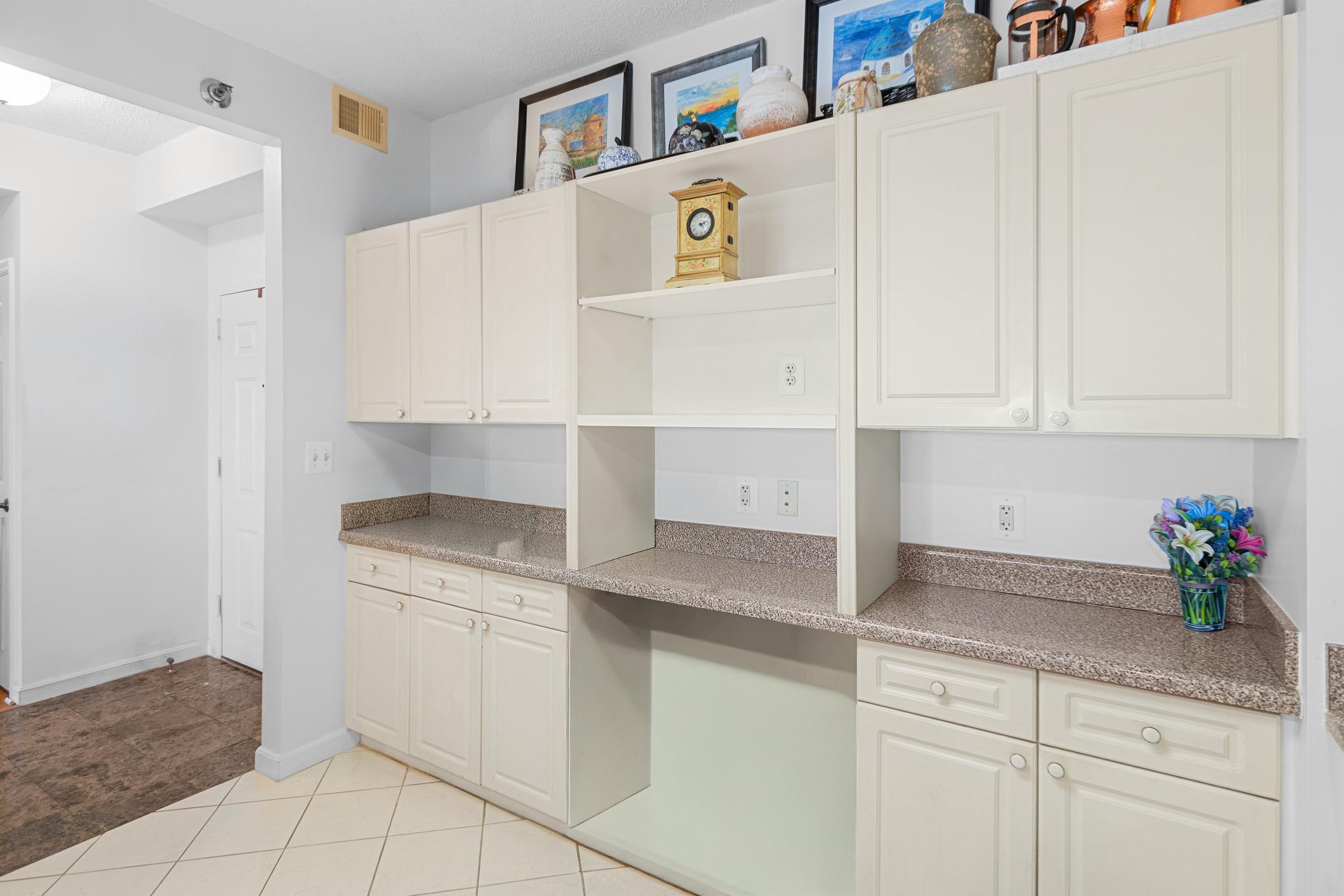 3005 South Leisure World Boulevard, Unit 702 Silver Spring, MD 20906 - Photo 9 of 43 a utility room with cabinets