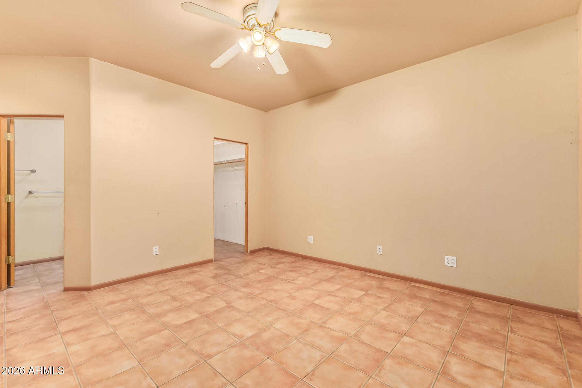 15137 South Moon Valley Road Arizona City, AZ 85123 - Photo 17 of 35 an empty room with a fan & a ceiling fan