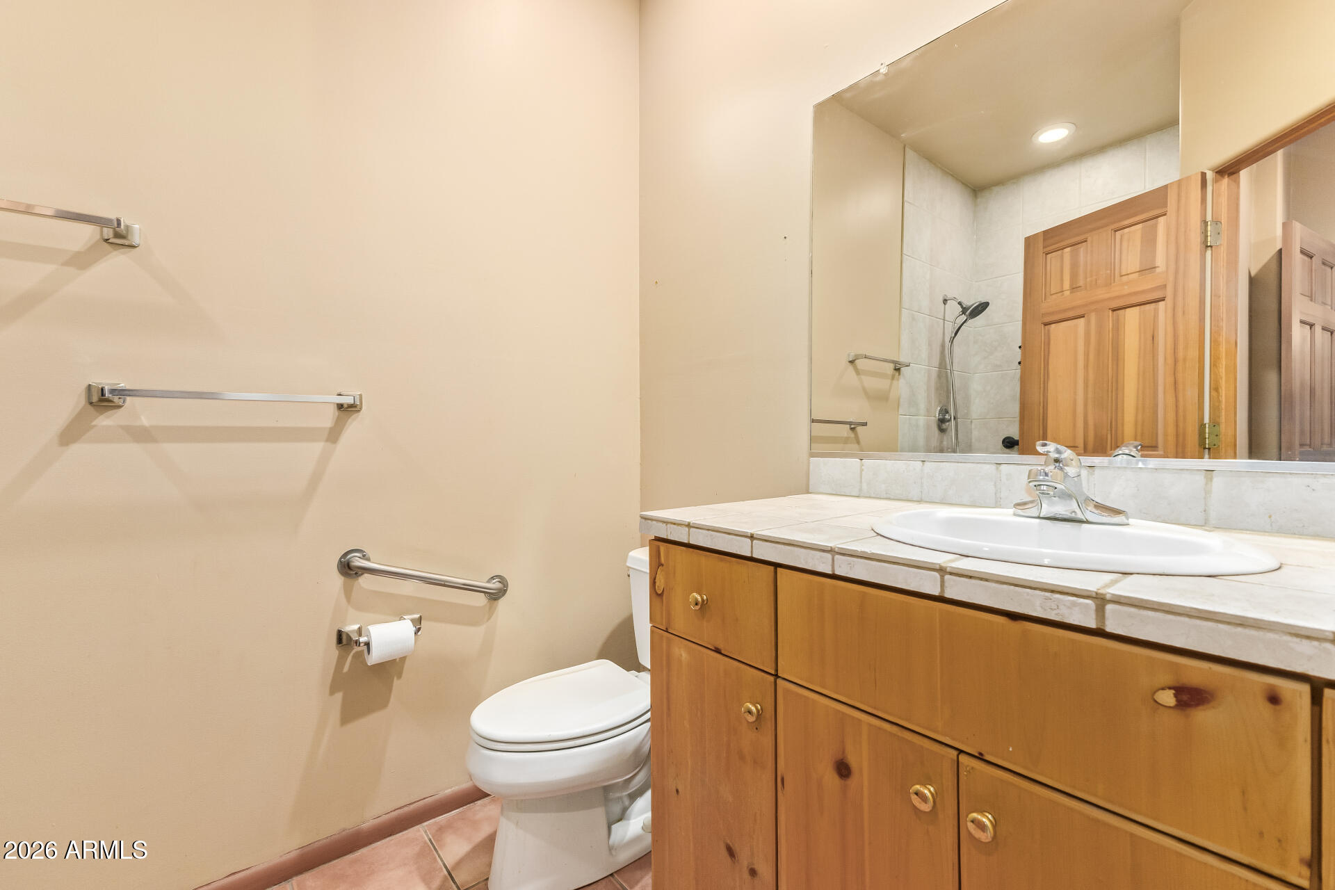 15137 South Moon Valley Road Arizona City, AZ 85123 - Photo 18 of 35 a bathroom with a granite countertop sink a toilet and a mirror