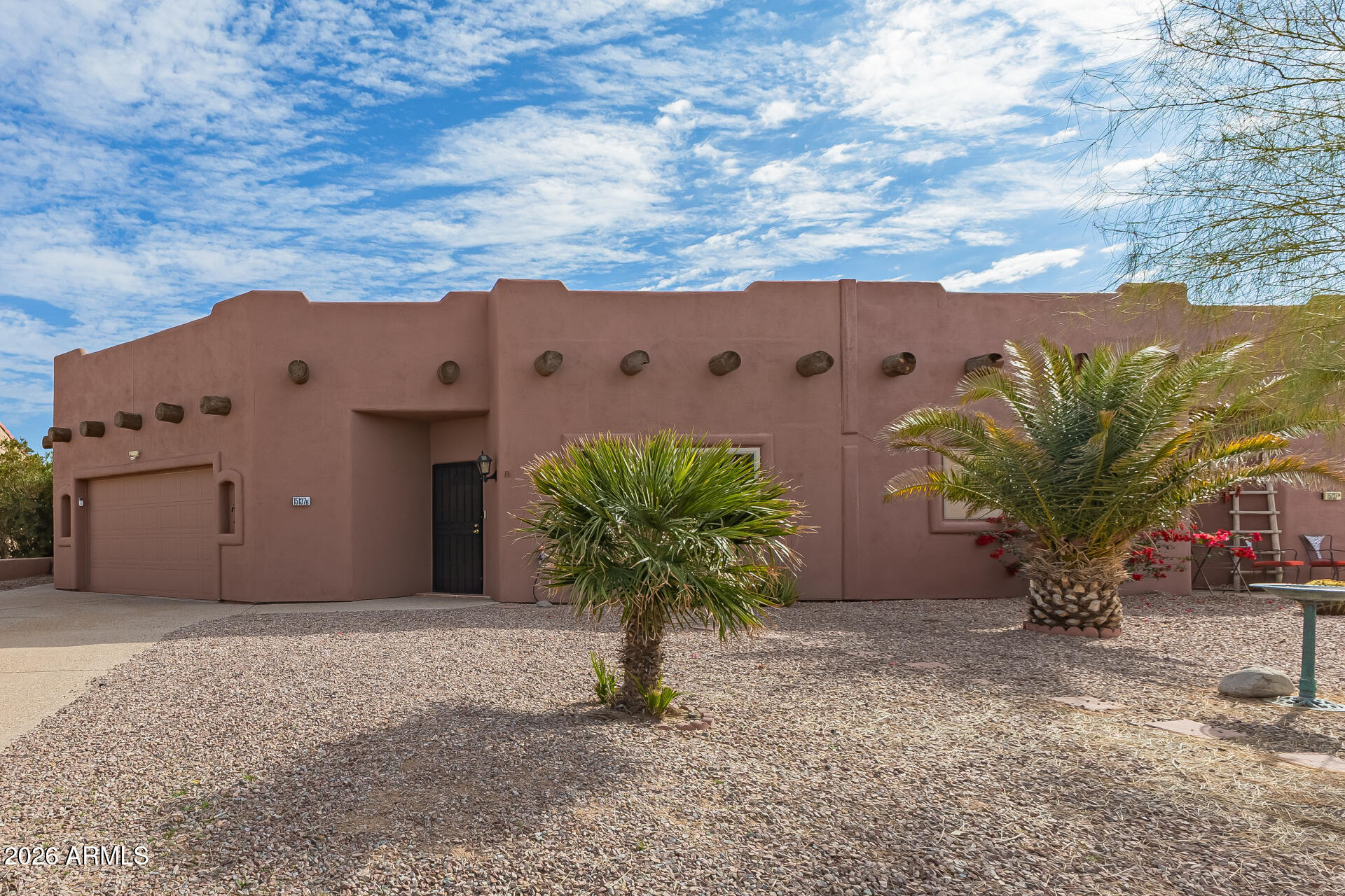 15137 South Moon Valley Road Arizona City, AZ 85123 - Photo 2 of 35 a view of a house with a yard and potted plants