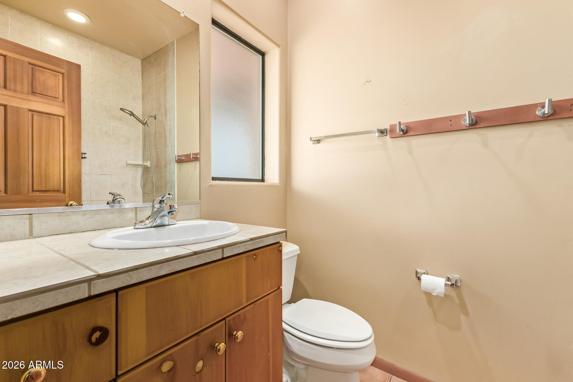 15137 South Moon Valley Road Arizona City, AZ 85123 - Photo 23 of 35 a bathroom with a sink and a mirror