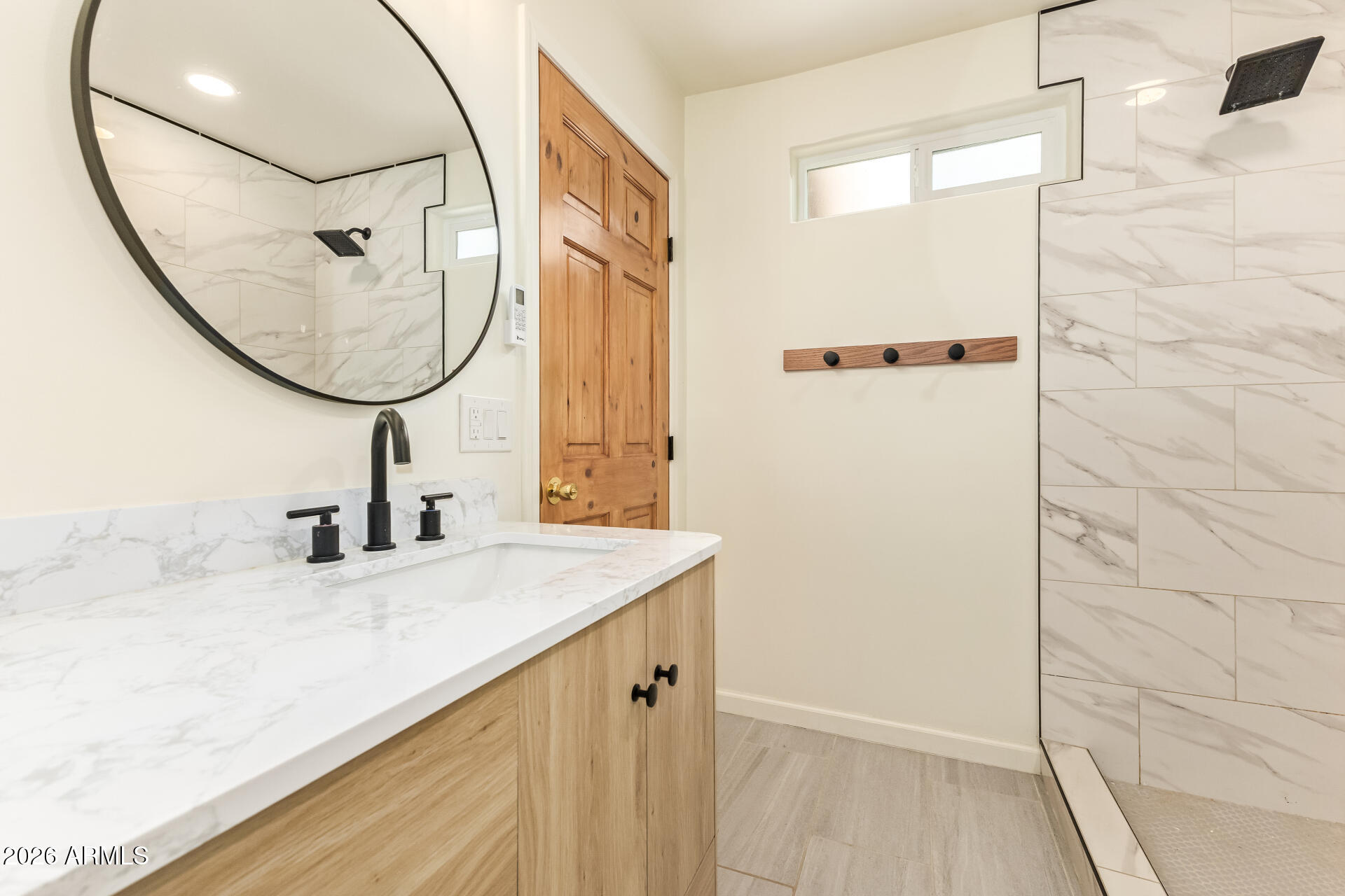15137 South Moon Valley Road Arizona City, AZ 85123 - Photo 27 of 35 a bathroom with a granite countertop sink a mirror and a shower