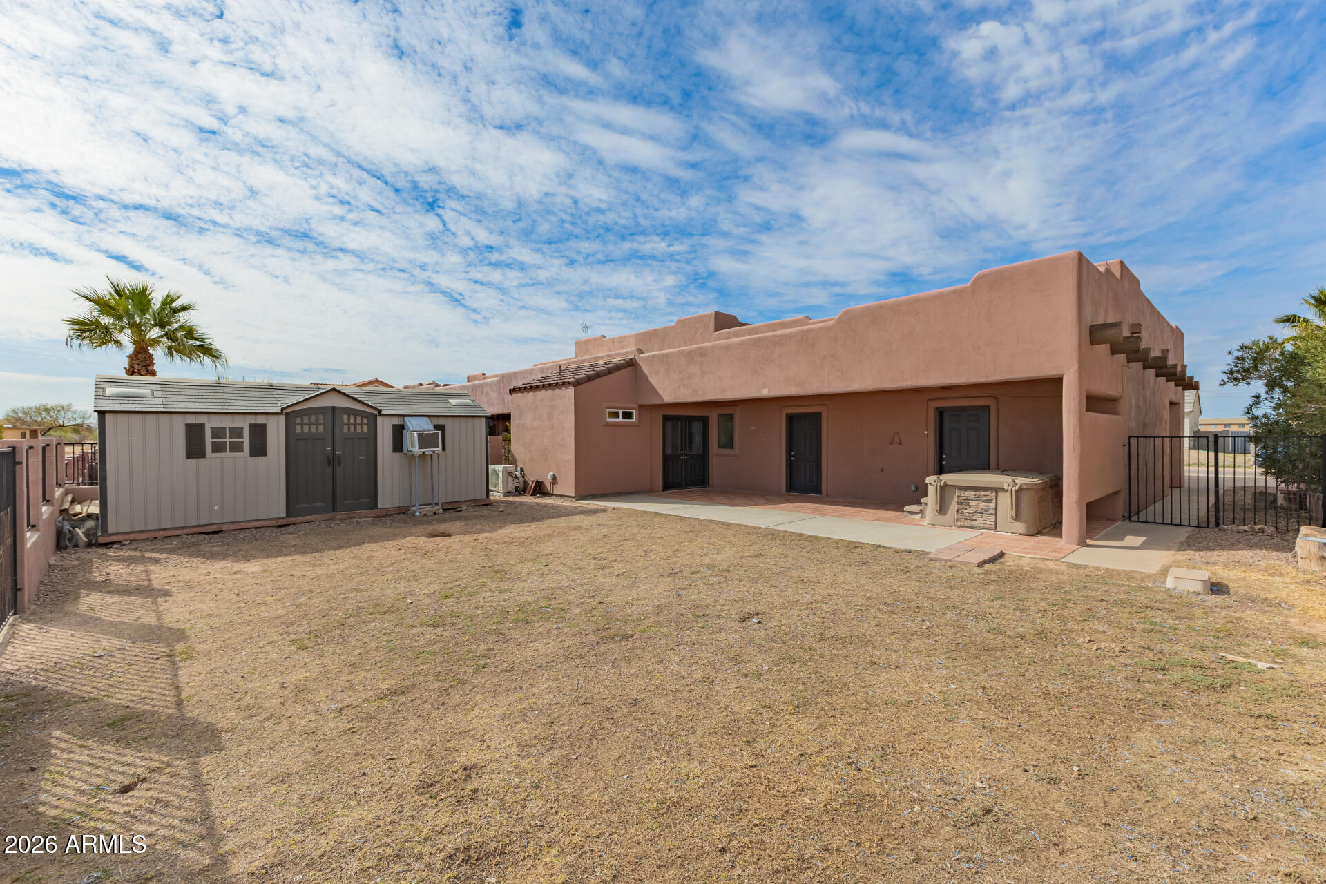 15137 South Moon Valley Road Arizona City, AZ 85123 - Photo 30 of 35 a front view of a house with a yard and garage
