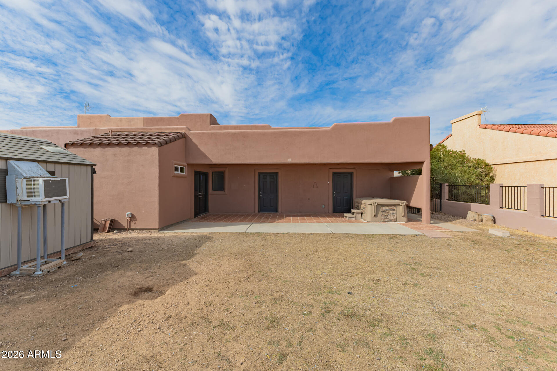 15137 South Moon Valley Road Arizona City, AZ 85123 - Photo 32 of 35 a front view of a house with a yard and garage
