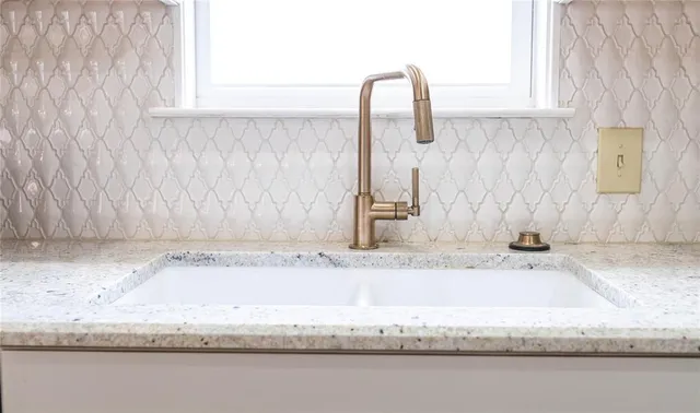 a bathroom with tub sink and vanity