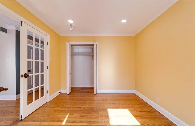 a view of hallway with wooden floor