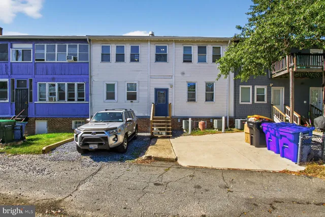 a car parked in front of a house