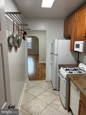 a kitchen with a stove and a refrigerator