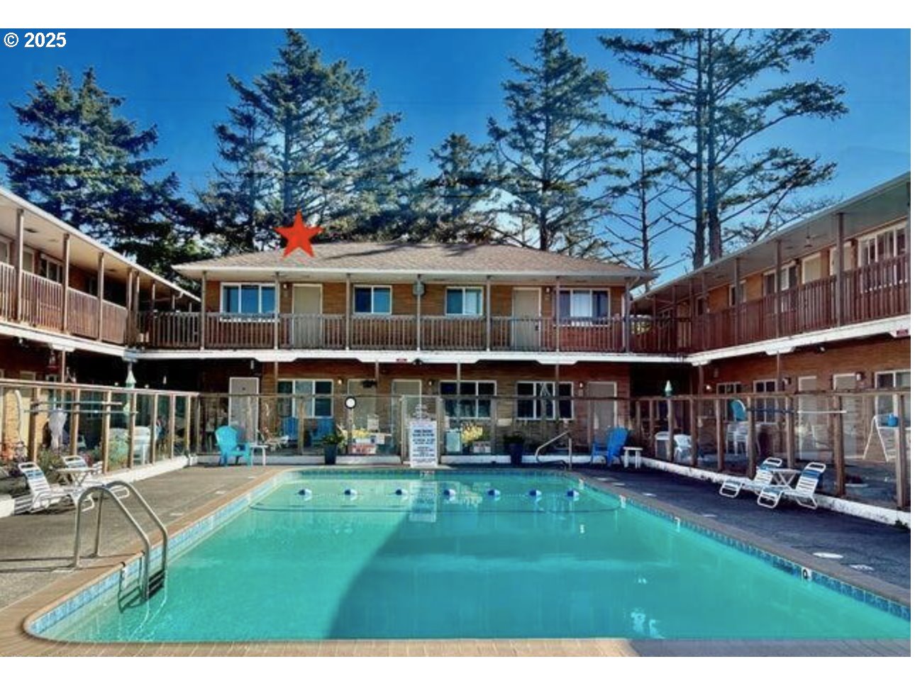 2233 Beach Drive, Unit 40 Seaside, OR 97138 - Photo 1 of 18 a front view of a building with a garden