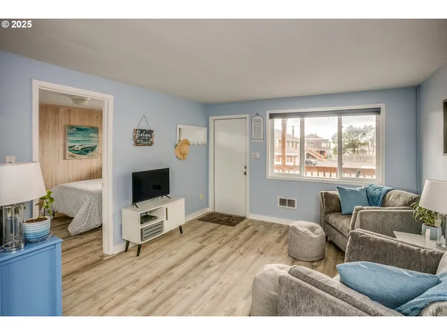 a kitchen with stainless steel appliances granite countertop a stove a refrigerator a sink and a refrigerator