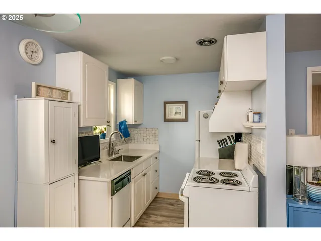 a kitchen with a stove and a refrigerator