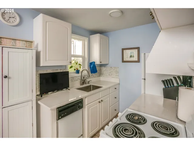 a bedroom with a large bed and a dresser