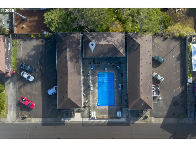 a view of a balcony with wooden floor and a book shelf