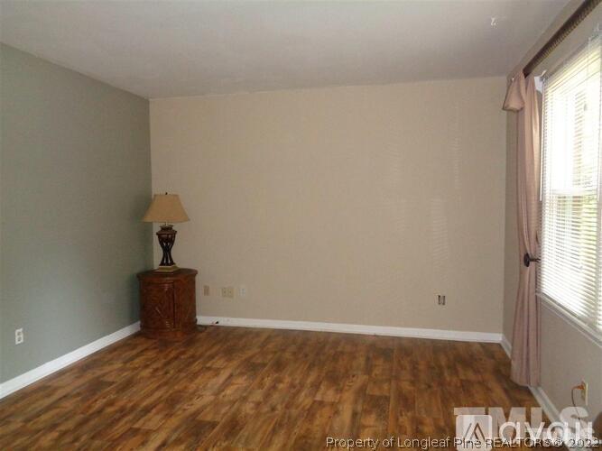 930 Jason Court Cary, NC 27511 - Photo 1 of 4 a view of empty room with wooden floor and fan
