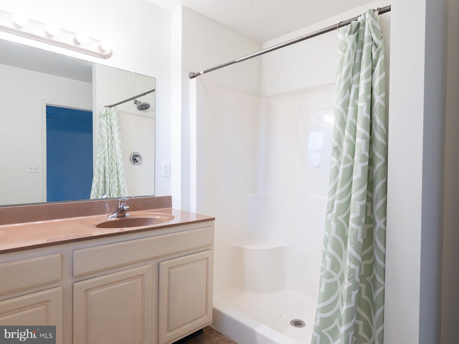 112 Hawk Court Hummelstown, PA 17036 - Photo 18 of 32 a bathroom with a granite countertop sink and a mirror