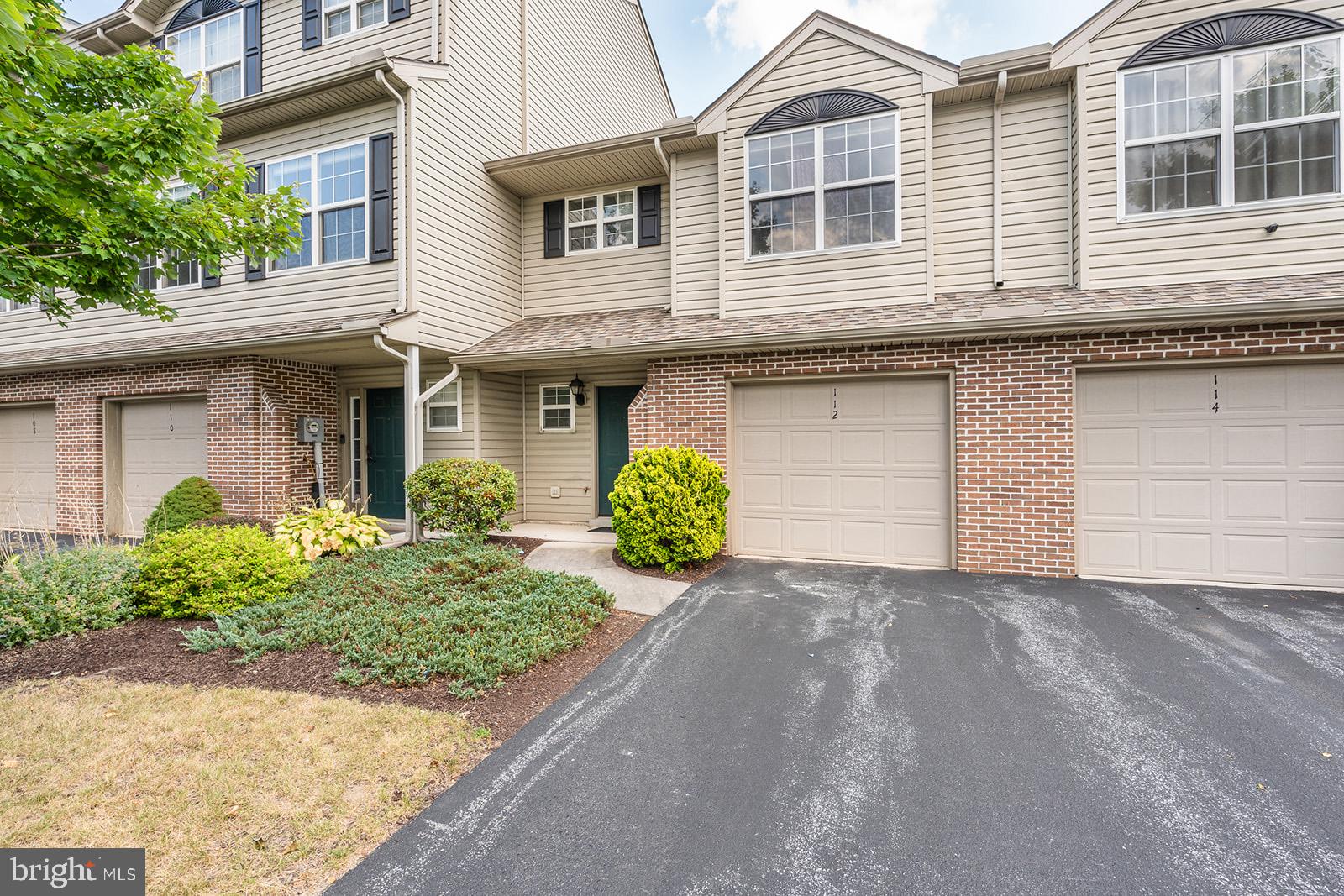 112 Hawk Court Hummelstown, PA 17036 - Photo 2 of 32 a front view of a house with garden