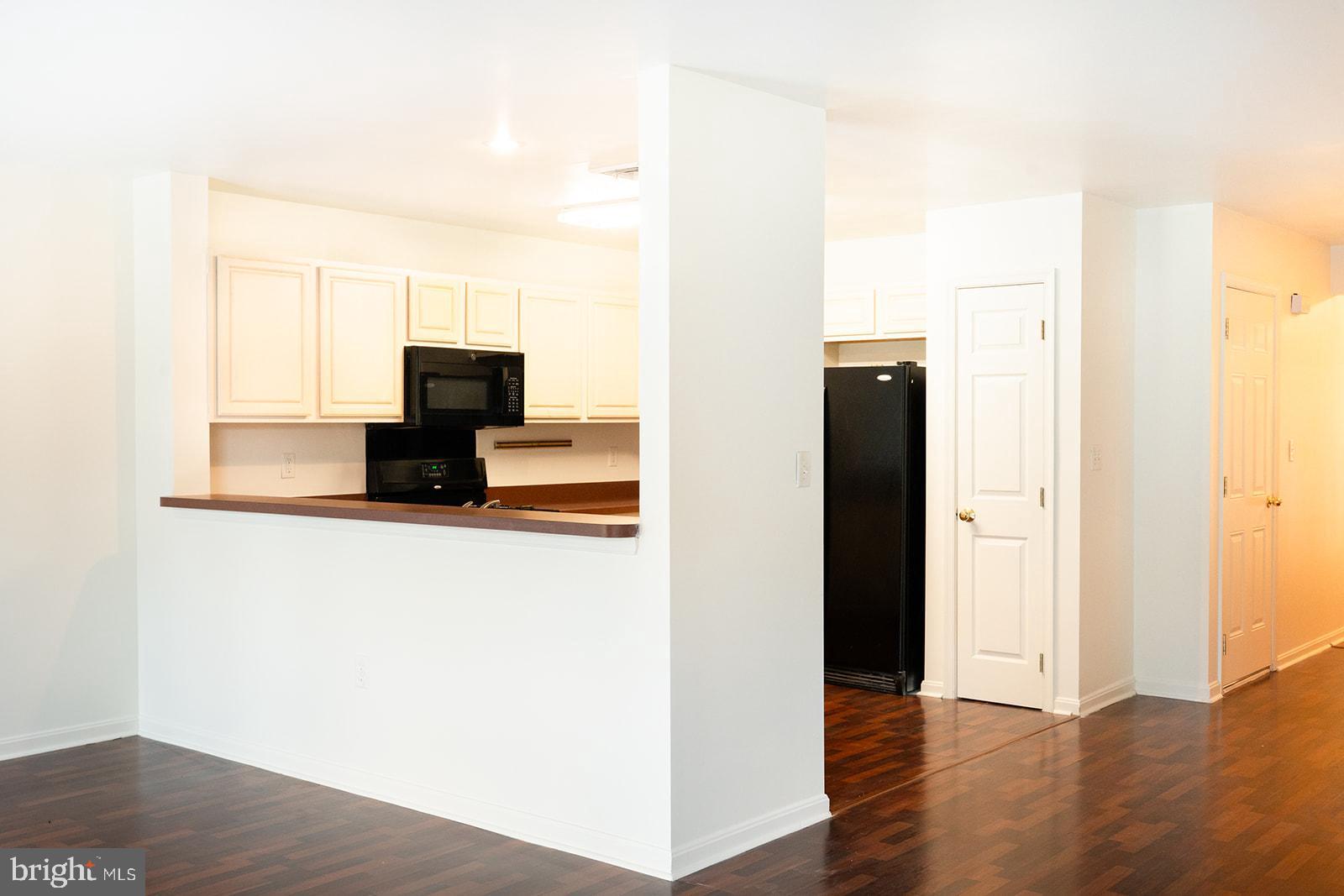 112 Hawk Court Hummelstown, PA 17036 - Photo 4 of 32 a view of flat screen tv with kitchen view