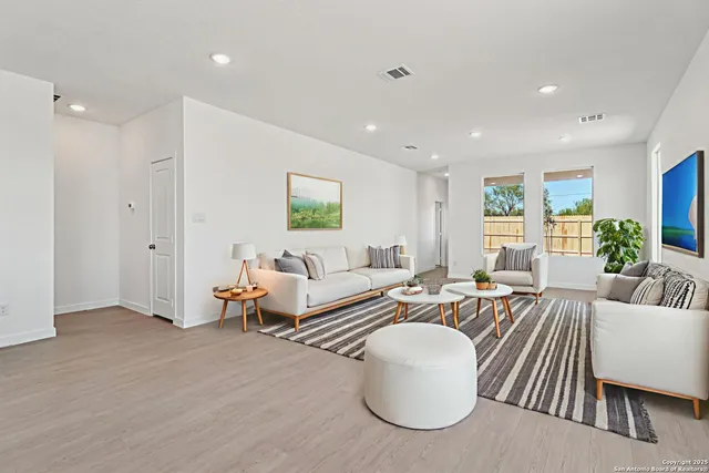 a living room with furniture and a table