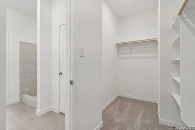 a view of an empty walk in closet