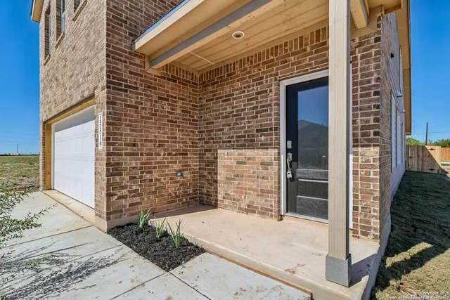 a brick building with a door and a window