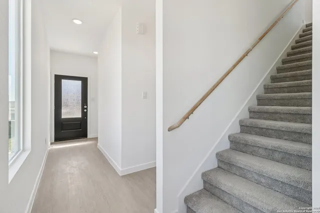 a view of entryway with wooden floor