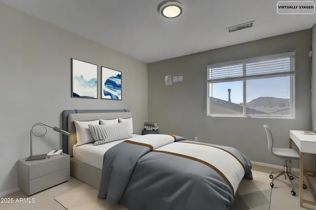 a bedroom with bed and window