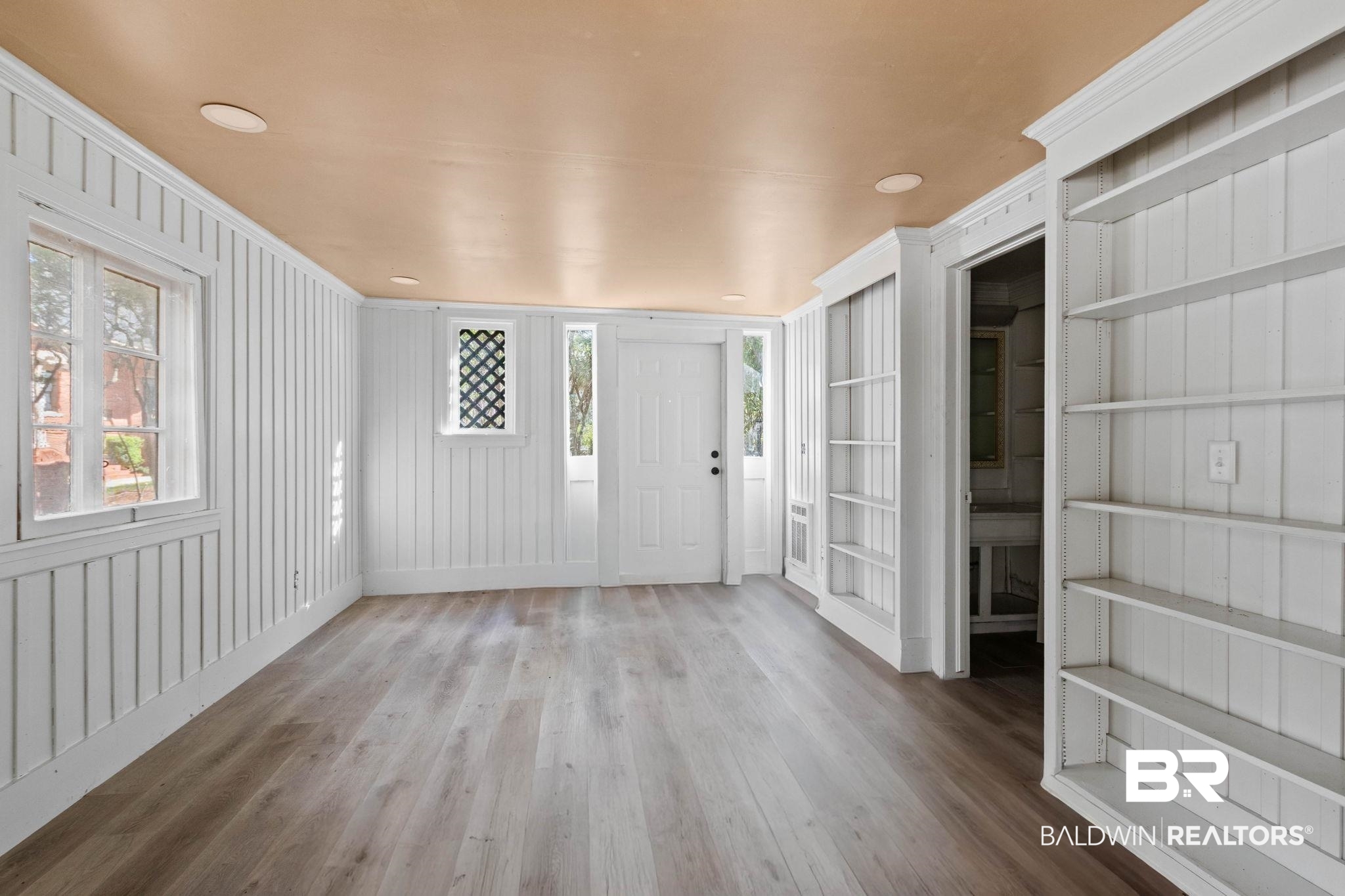 1701 Sowell Road Brewton, AL 36426 - Photo 83 of 83 Foyer entrance with light wood-style flooring and ornamental molding