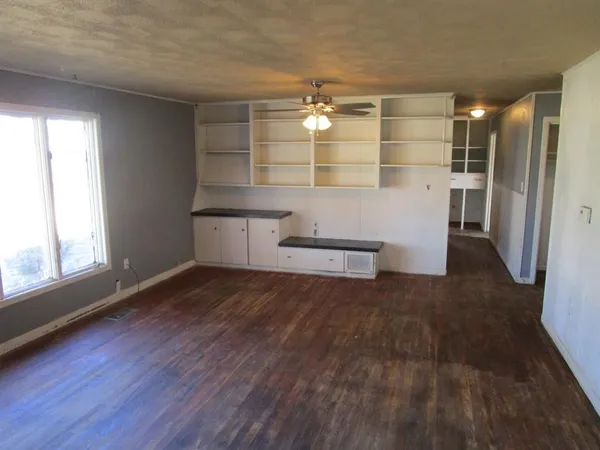 a kitchen with a sink appliances and cabinets