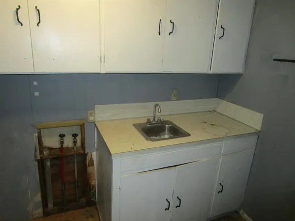 a bathroom with a bathtub sink and a shower