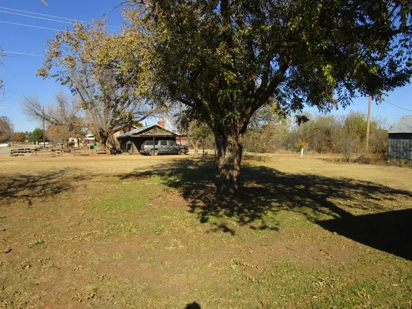 a view of a backyard of the house