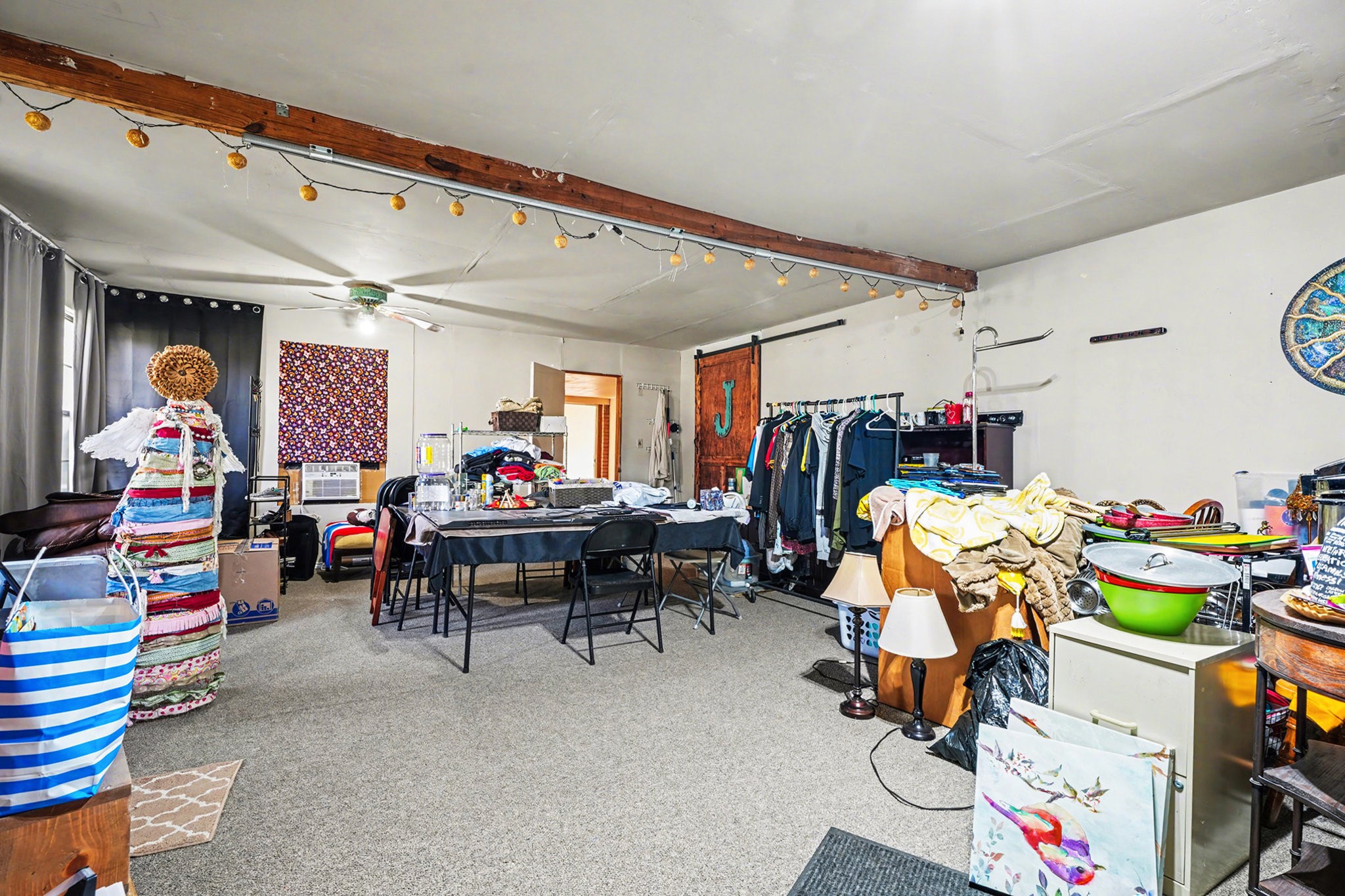 4802 Crosby Cedar Bayou Road Baytown, TX 77521 - Photo 20 of 28 a living room filled with furniture and a baby crib