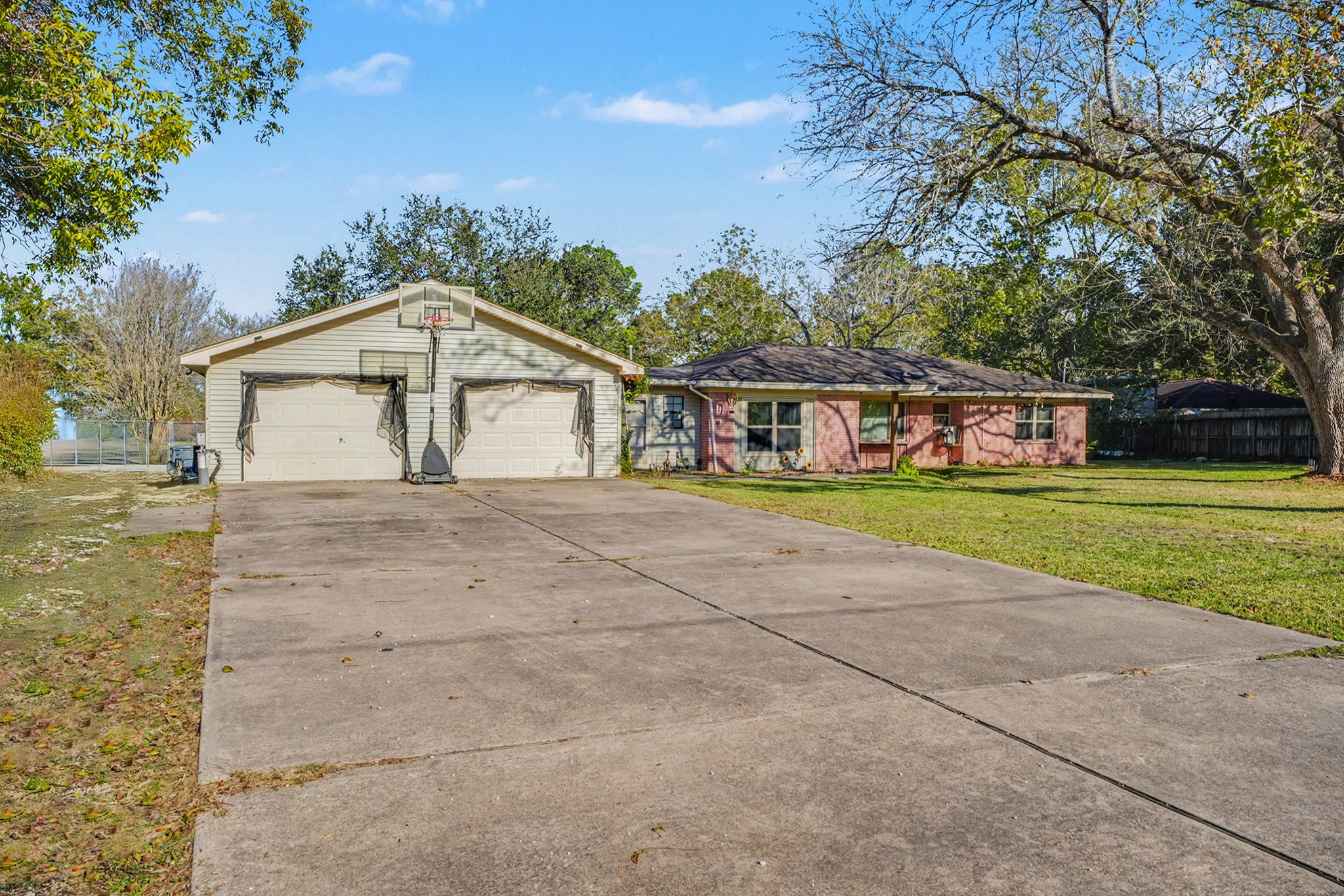 4802 Crosby Cedar Bayou Road Baytown, TX 77521 - Photo 2 of 28 a front view of a house with a garden
