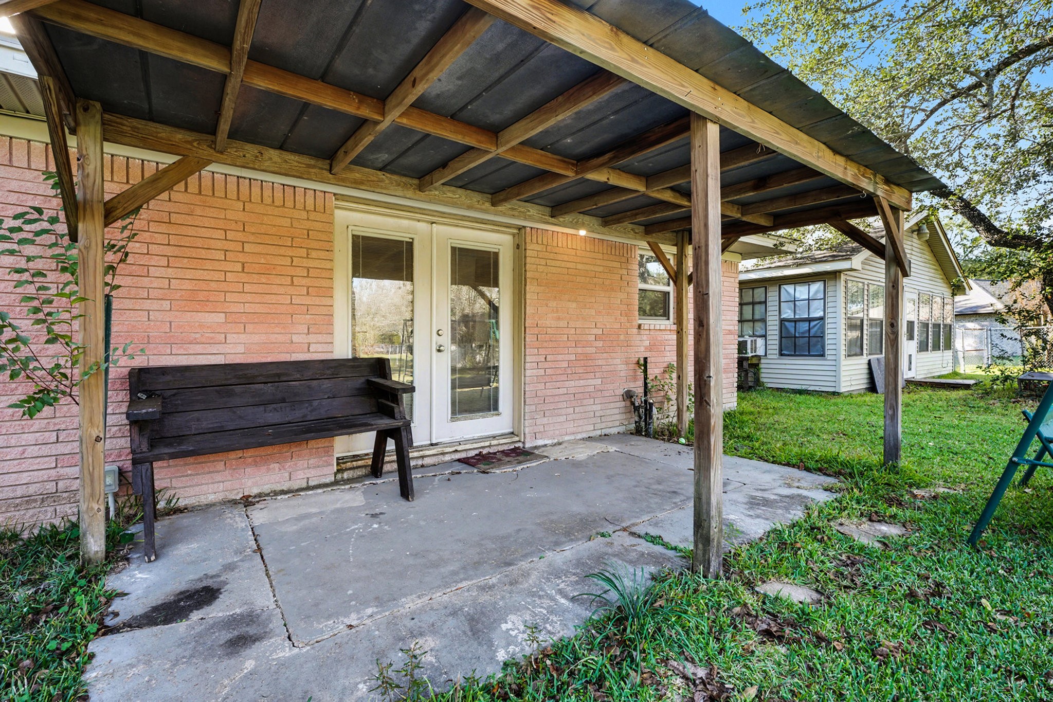 4802 Crosby Cedar Bayou Road Baytown, TX 77521 - Photo 22 of 28 a view of a porch with chairs and a yard