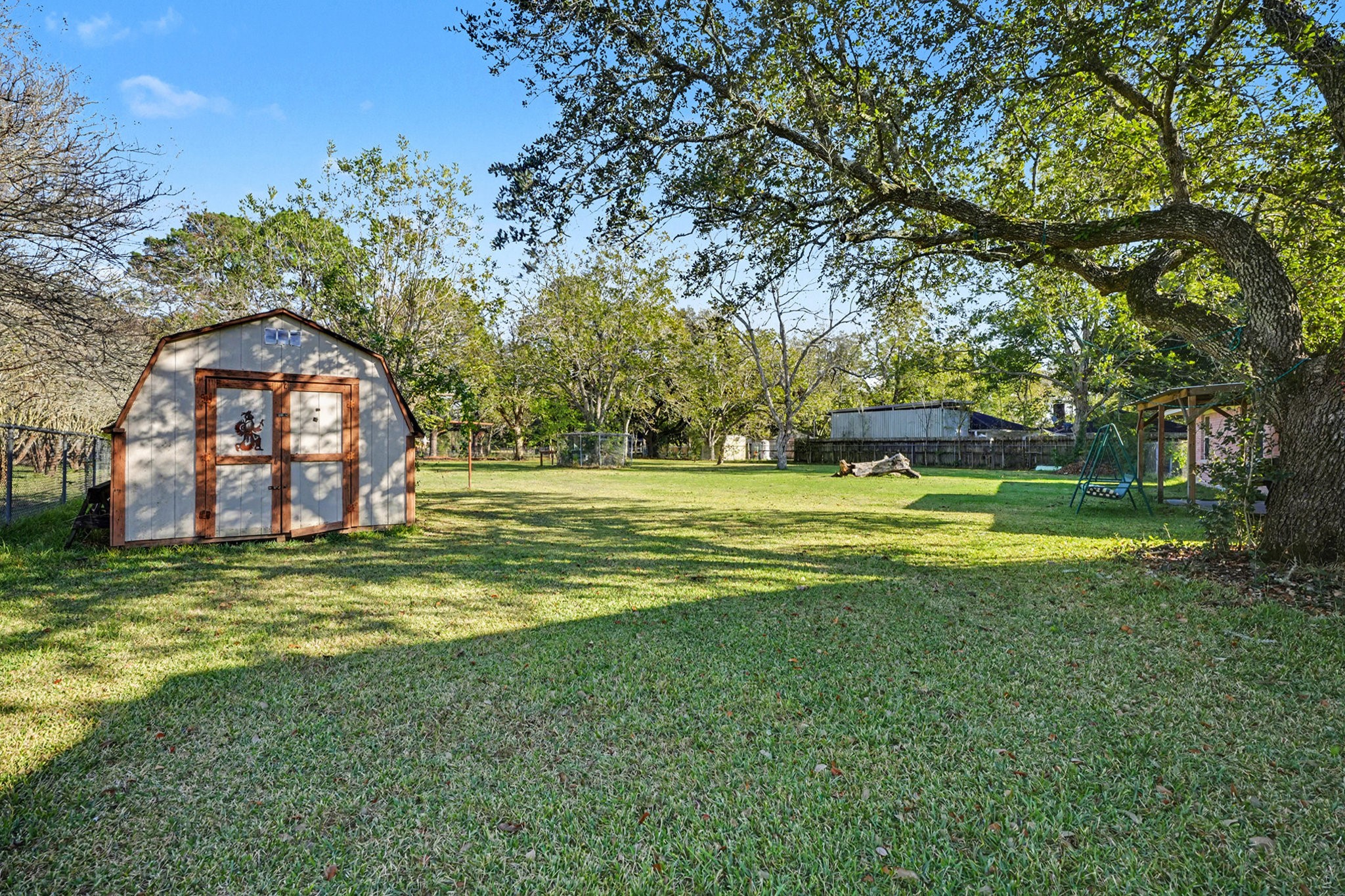 4802 Crosby Cedar Bayou Road Baytown, TX 77521 - Photo 24 of 28 a swimming pool with outdoor seating and yard