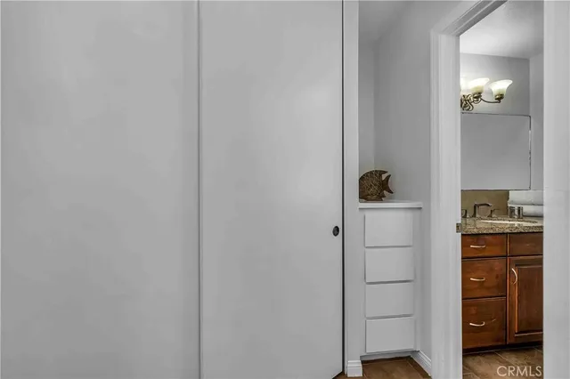 a view of a chair and tables in the patio of a house