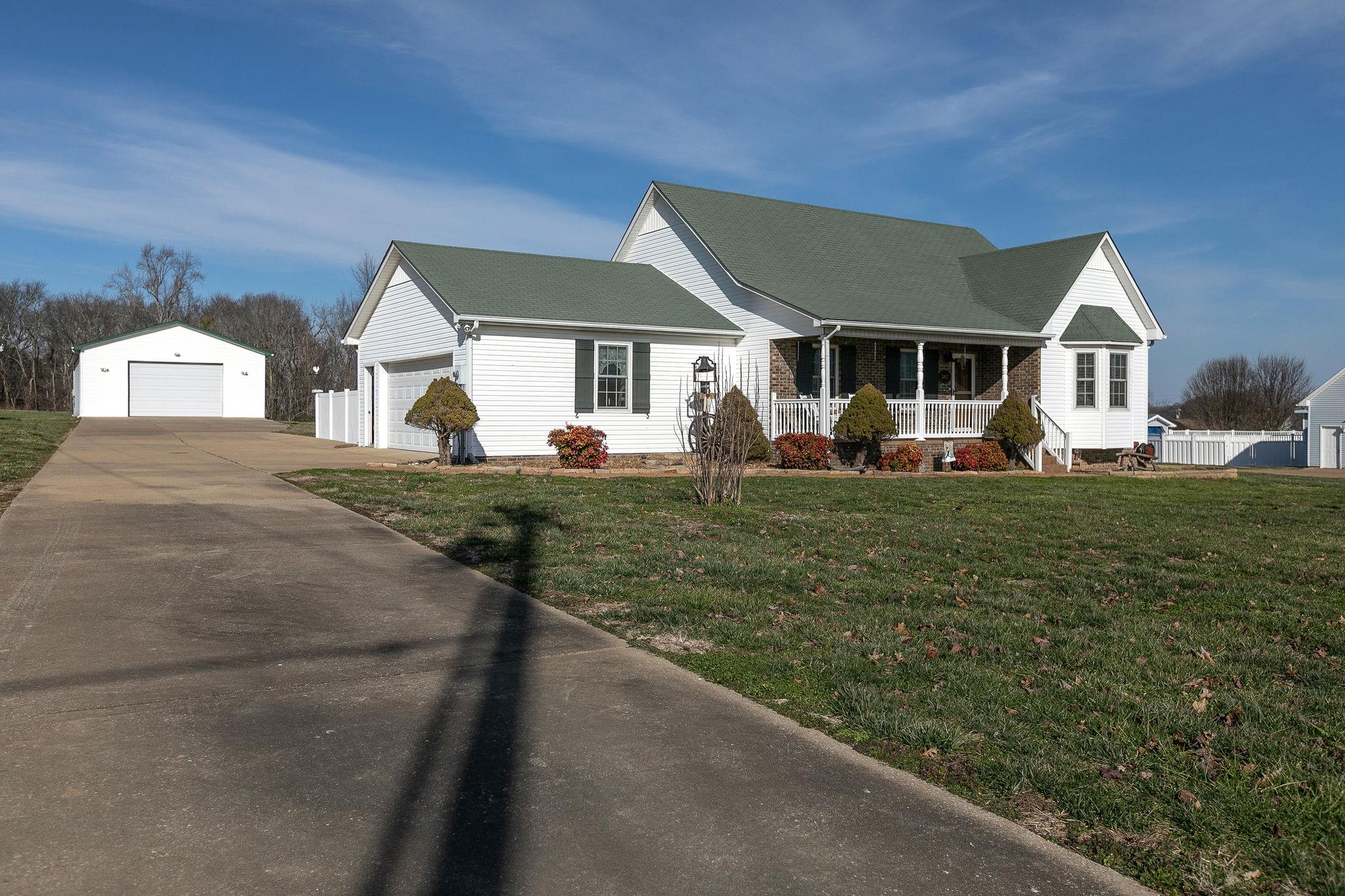 3467 Greens Mill Road Spring Hill, TN 37174 - Photo 2 of 28 a front view of a house with a yard