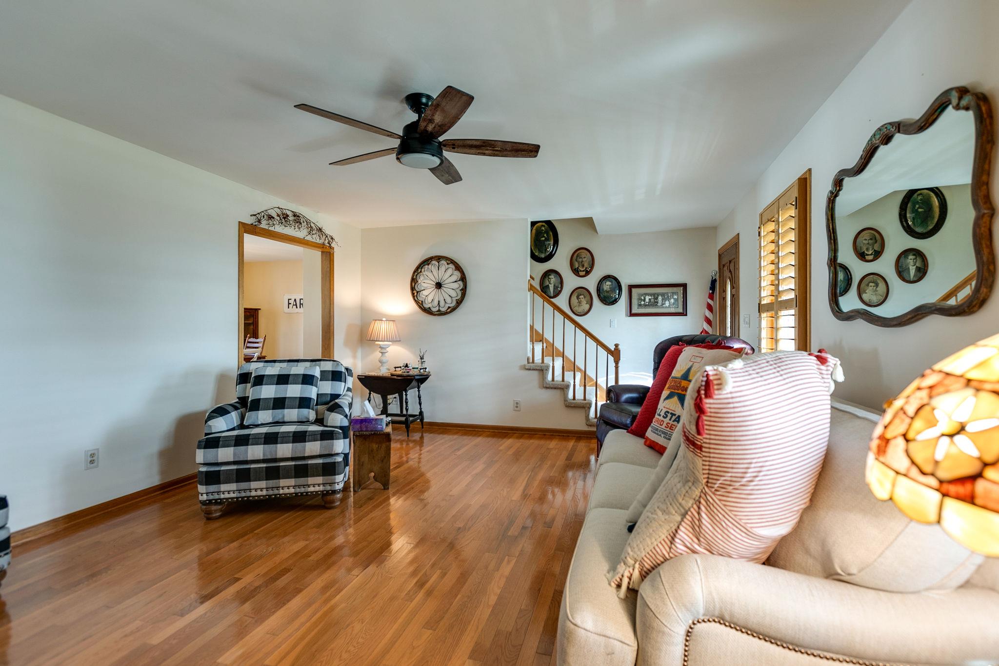 3467 Greens Mill Road Spring Hill, TN 37174 - Photo 20 of 28 a living room with furniture and a wooden floor