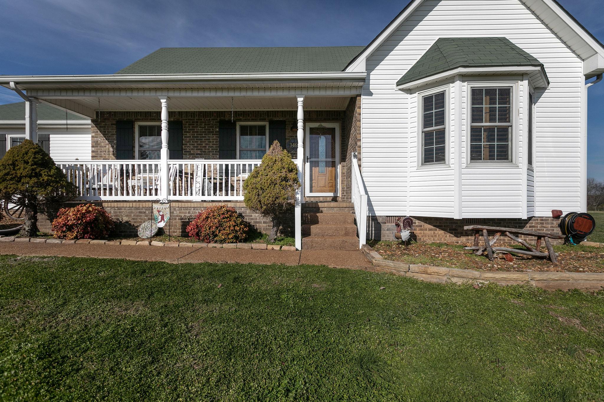 3467 Greens Mill Road Spring Hill, TN 37174 - Photo 3 of 28 a front view of a house with garden