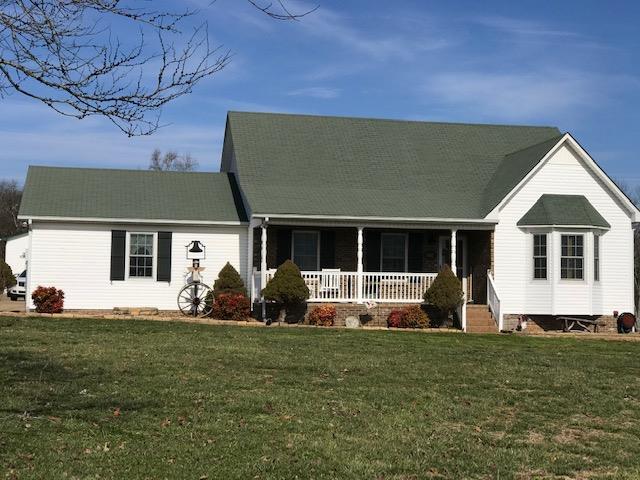 3467 Greens Mill Road Spring Hill, TN 37174 - Photo 4 of 28 a front view of a house with a garden