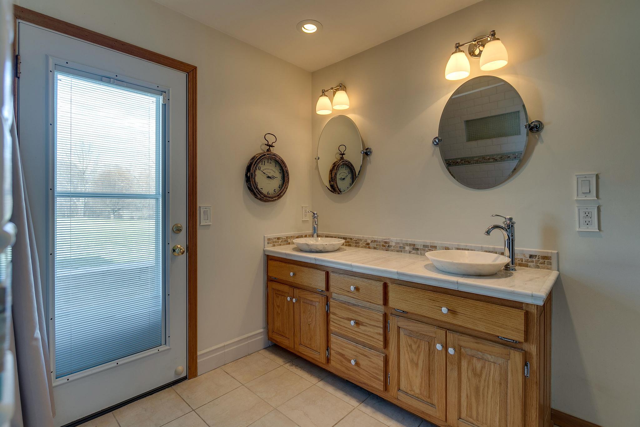 3467 Greens Mill Road Spring Hill, TN 37174 - Photo 10 of 28 a bathroom with a double vanity sink and a mirror