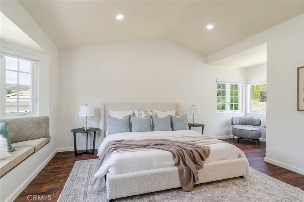 31256 Quail Valley Road Castaic, CA 91384 - Photo 15 of 31 a bedroom with a bed and wooden floor