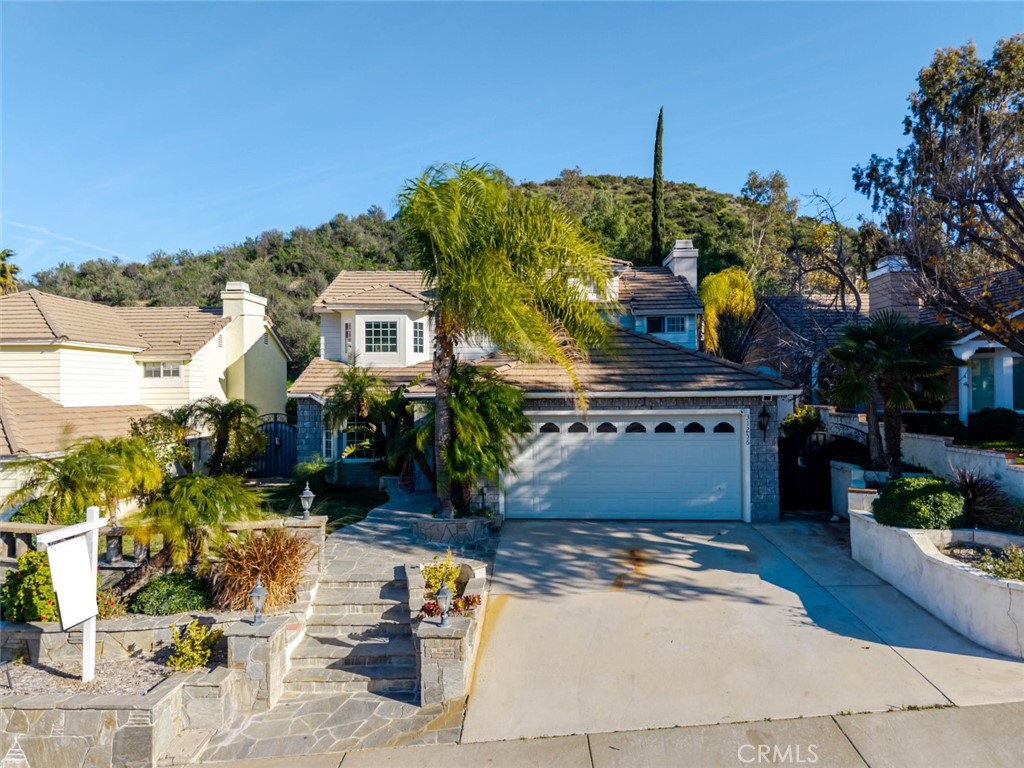 31256 Quail Valley Road Castaic, CA 91384 - Photo 5 of 31 a front view of a house with a yard