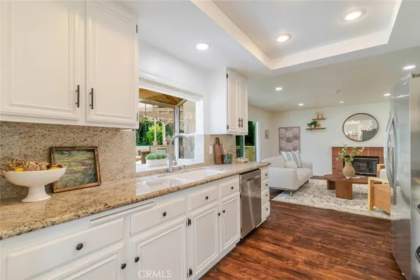a spacious bathroom with double vanity and a large mirror