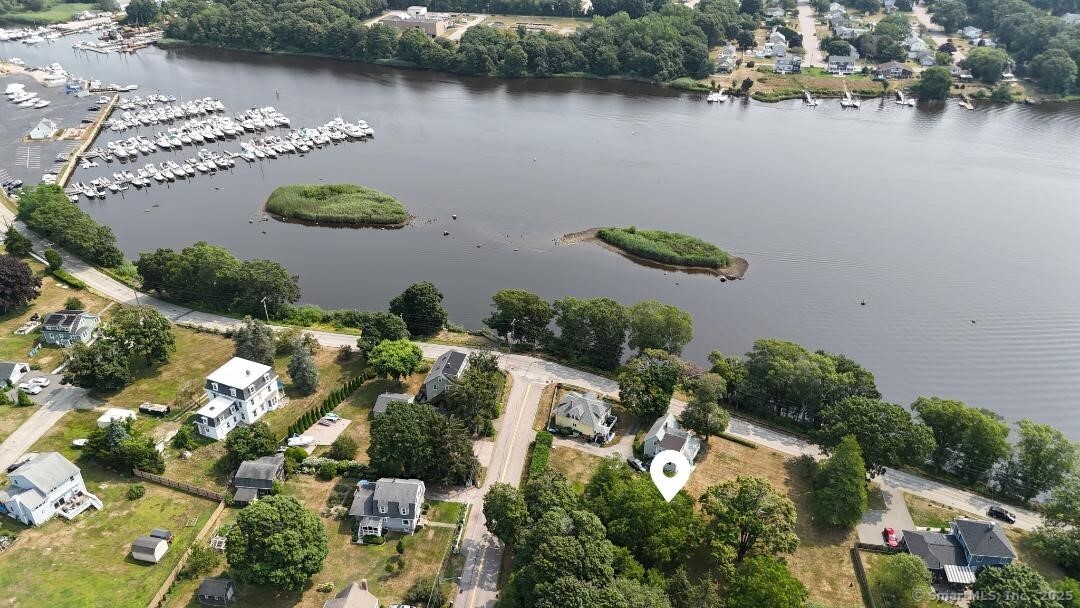 an aerial view of a house with a lake view