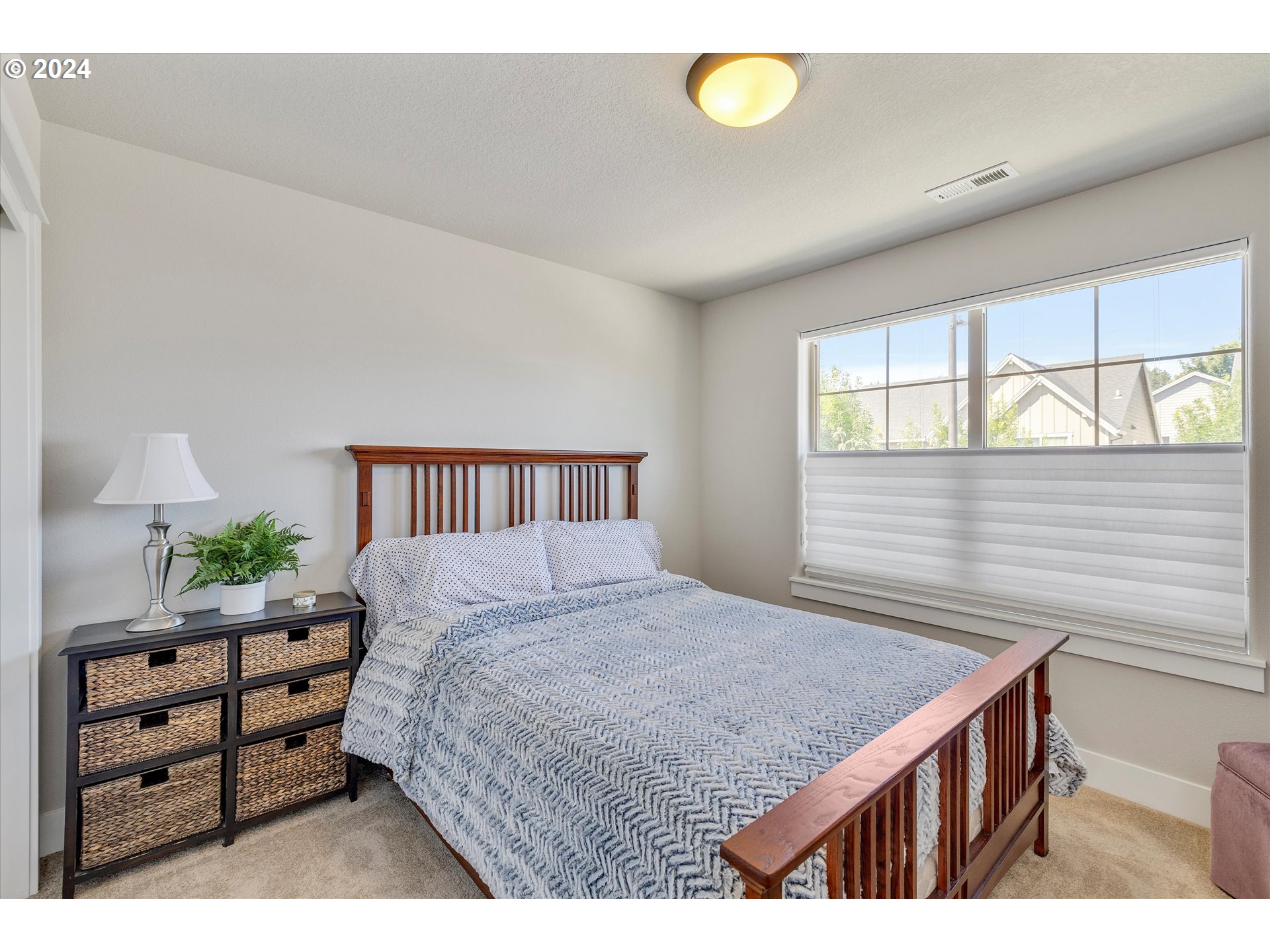 12934 Southwest Buckfield Lane Portland, OR 97224 - Photo 16 of 27 a bedroom with a bed and a window