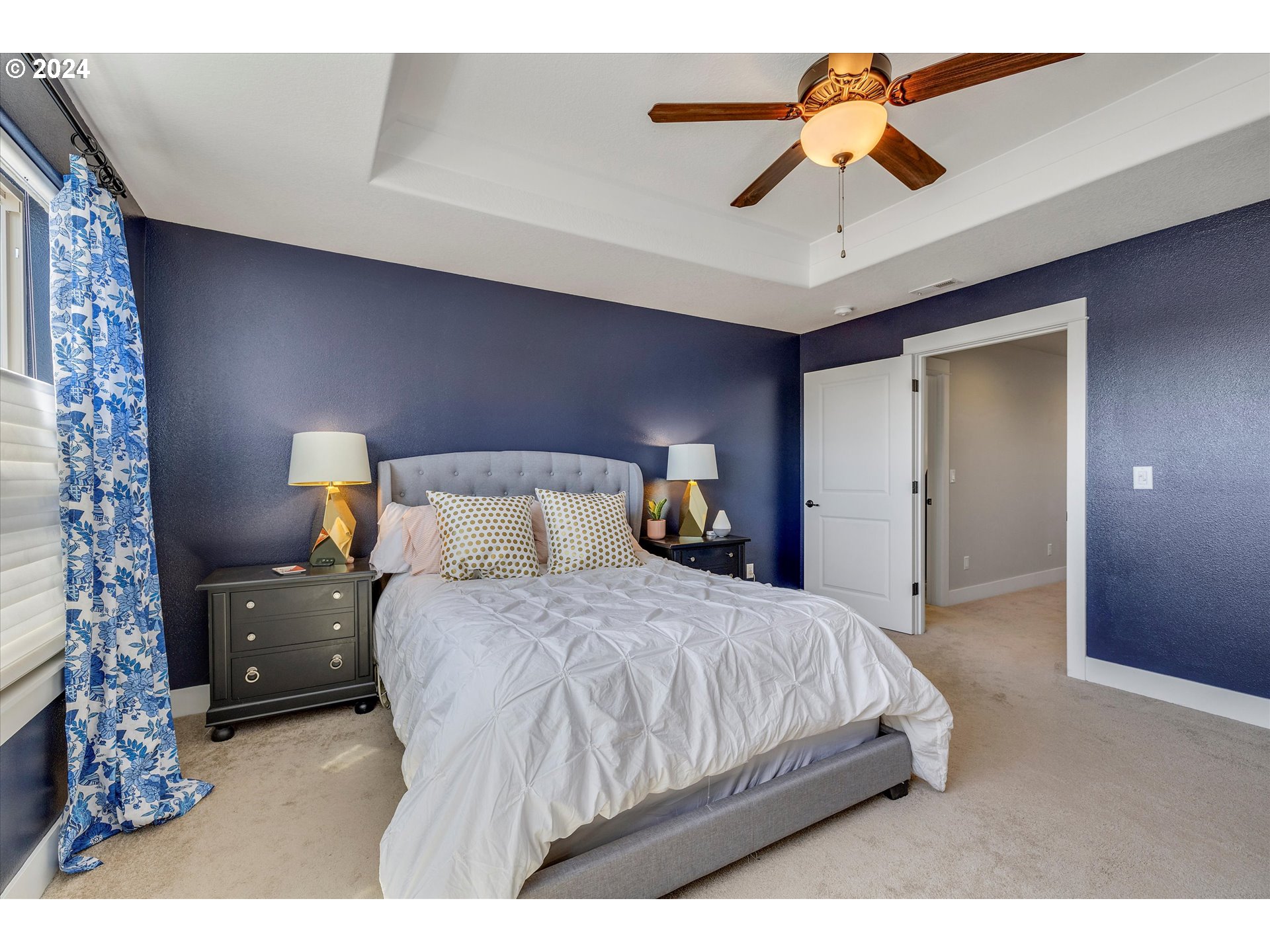 12934 Southwest Buckfield Lane Portland, OR 97224 - Photo 18 of 27 a bedroom with a bed and a chandelier
