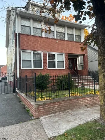 front view of a house with a street
