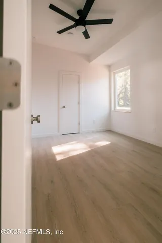 a bathroom with a bathtub and toilet